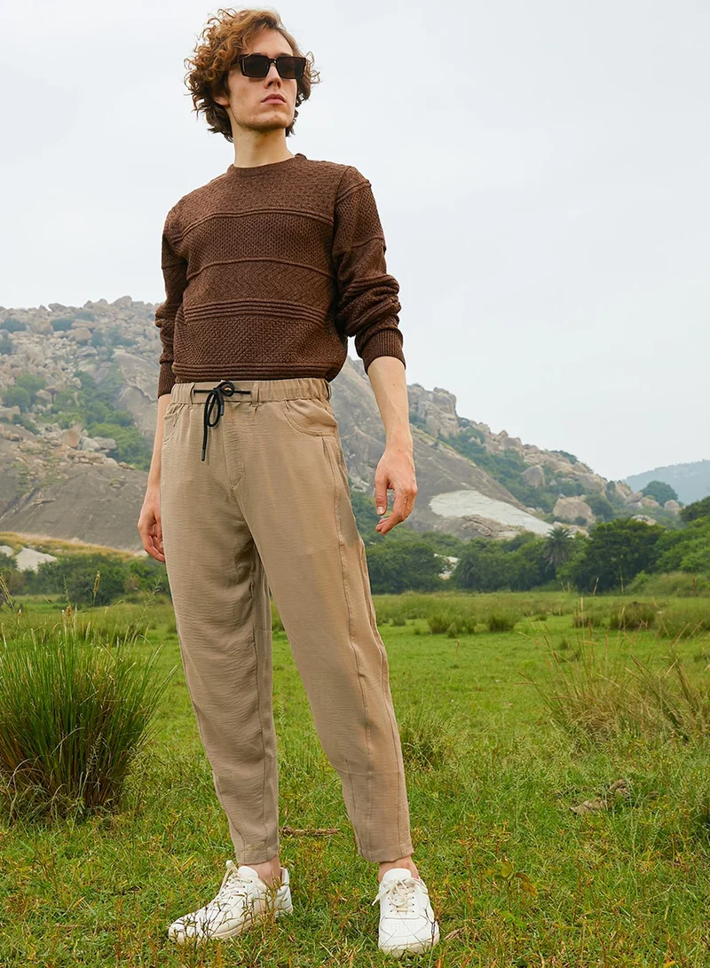 CAHOOT  Men's Khaki Beige Solid Tapered Trousers For Casual Wear | Low-Rise | 4 Pockets | Drawstring Closure | Trousers Crafted With Comfort Fit For Everyday Wear for Men | Best Price UAE